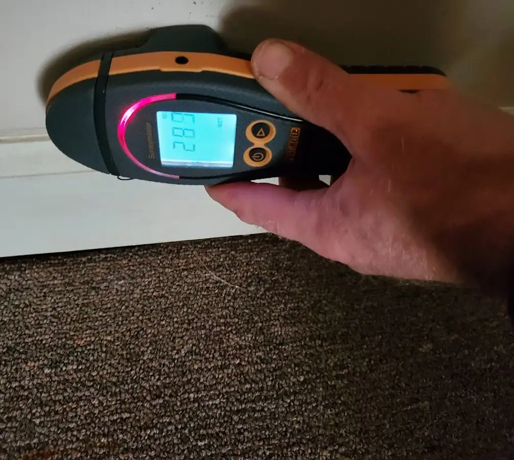 Moisture detection at baseboard during Storm Damage Restoration in Modesto